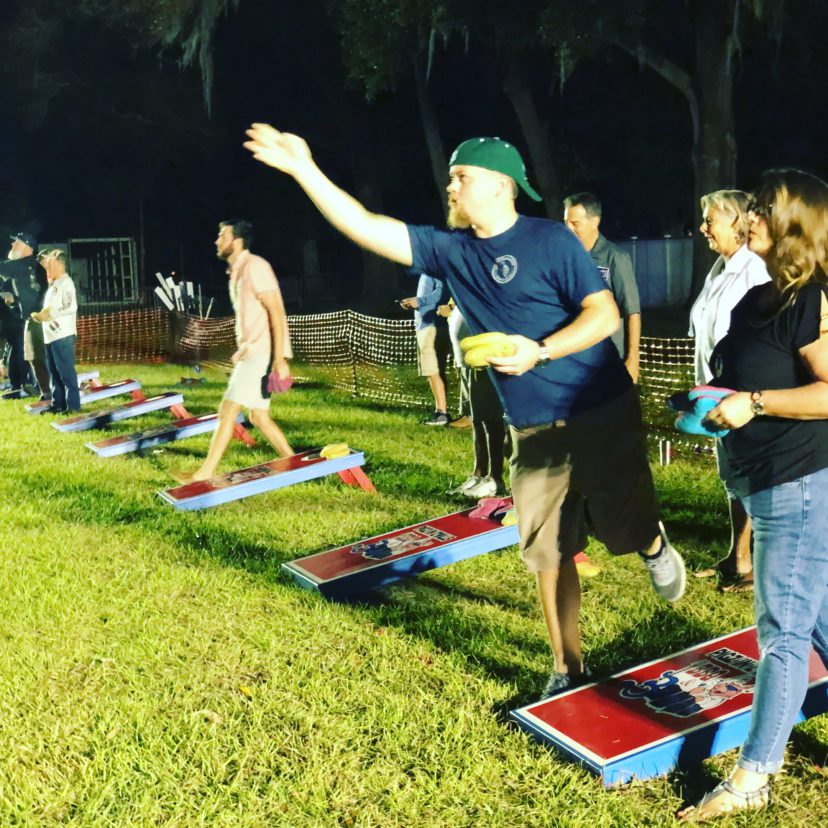 cornhole competition at pigz in z'hills